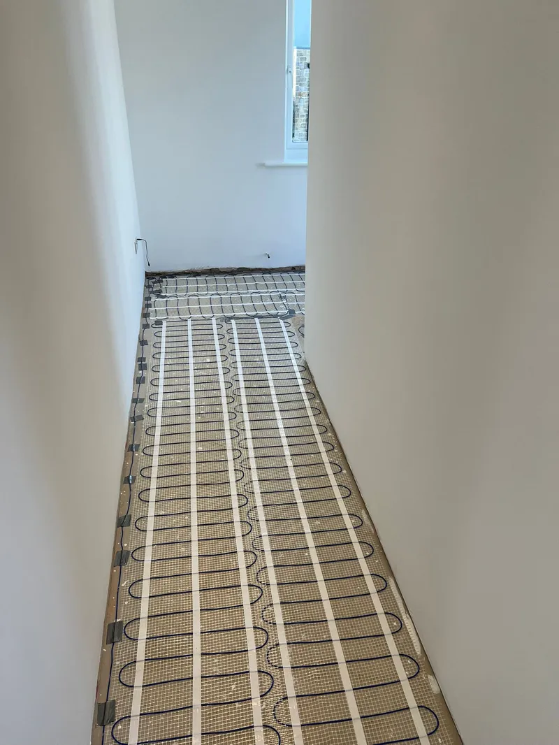 Electric underfloor heating mat installed in hallway of Dorset home