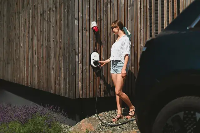 EV charger installed on driveway wall in Poole